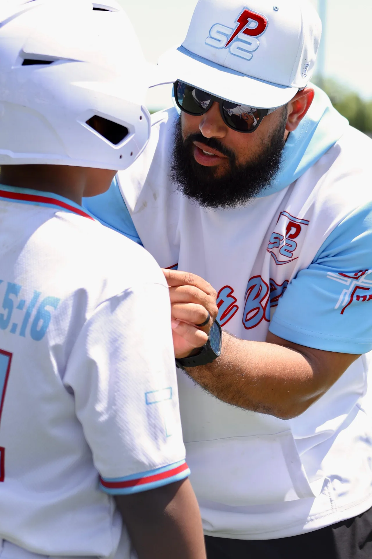 Coach mentoring a young player
